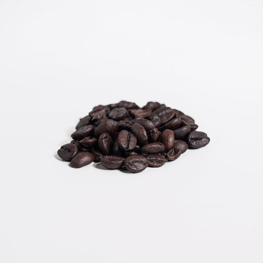 Pile of coffee beans on a white background